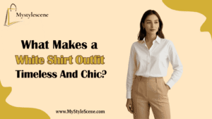 A woman in a classic white button-down shirt paired with high-waisted beige trousers, styled with a brown belt and a tan bag.